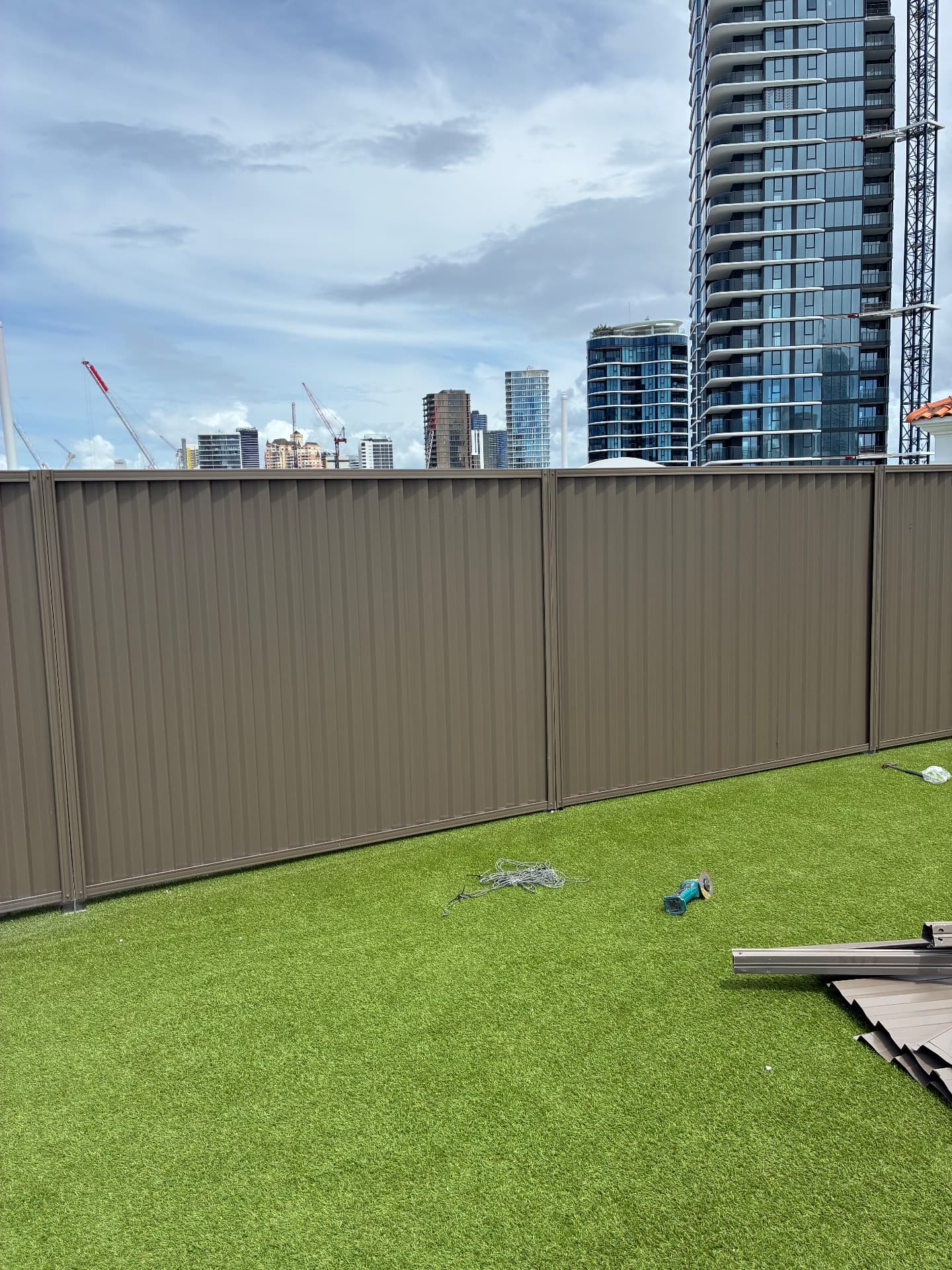 Colourbond fence with the Gold Coast skyline behind it