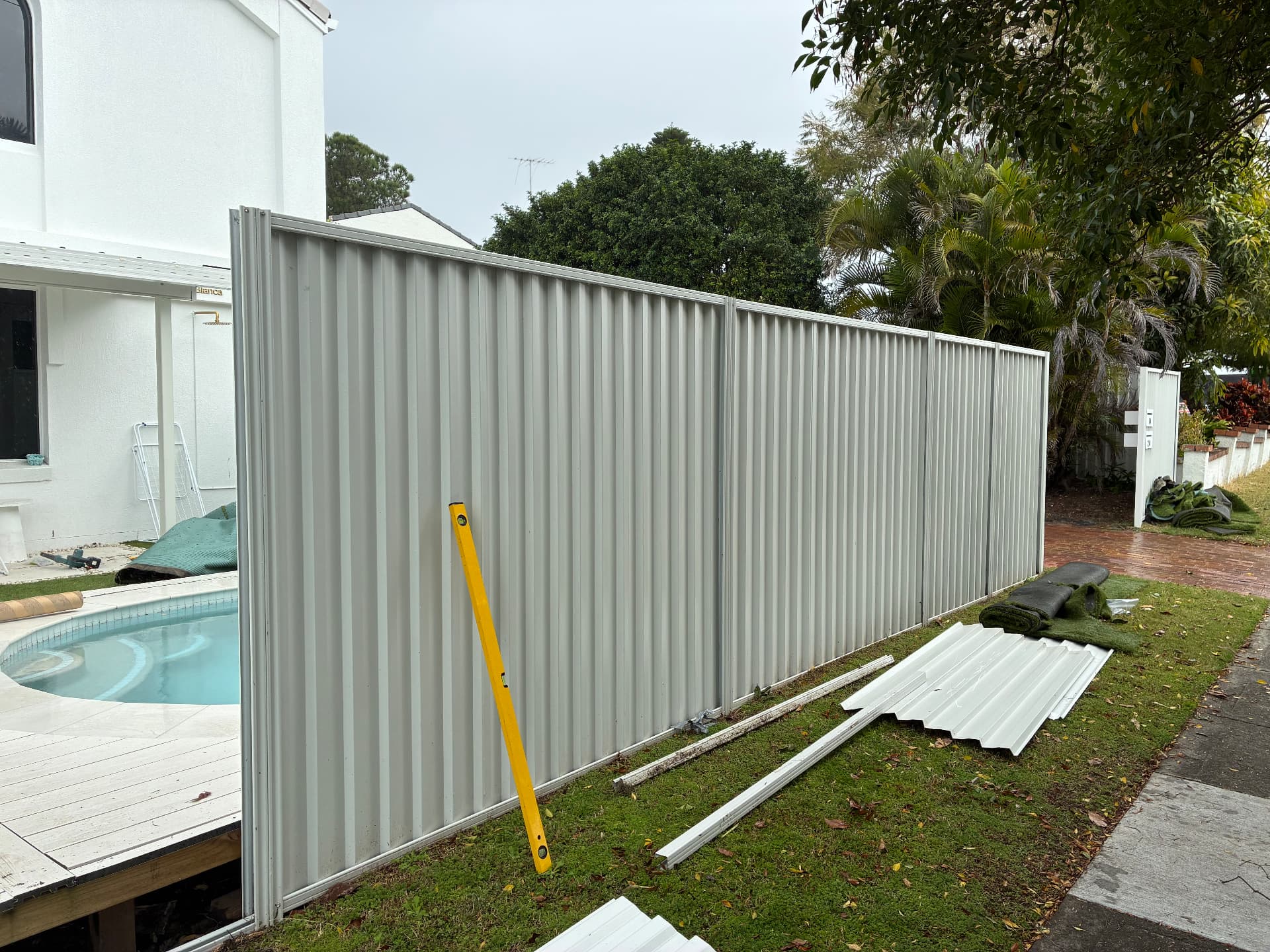 Colourbond fence installed beside a swimming pool