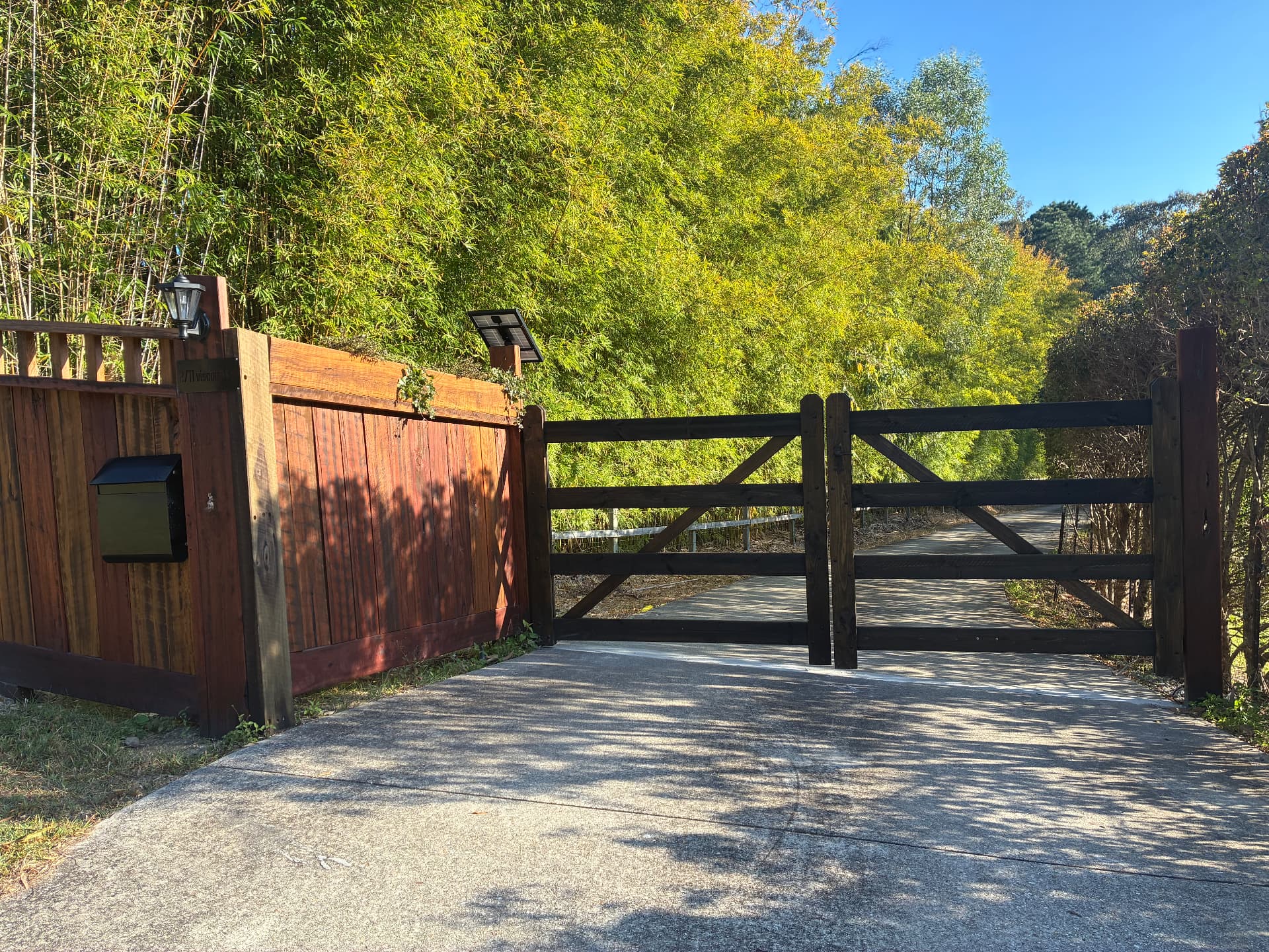 Real timber fence and farm-style gate installed on a hinterland property